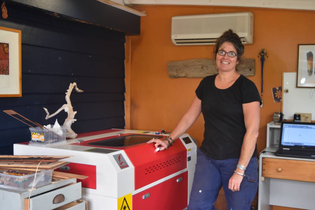 Sarah Scheltema in the studio which houses a state of the art laser capable of burning and cutting her intricate designs from funky jewellery to leather, wood and framed artworks. 