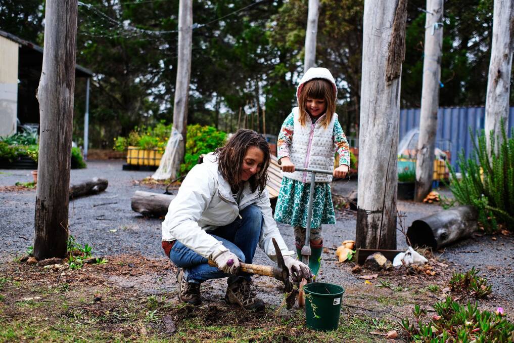 A volunteer and her helper at the Margaret River community garden. Photo: Russell Ord.