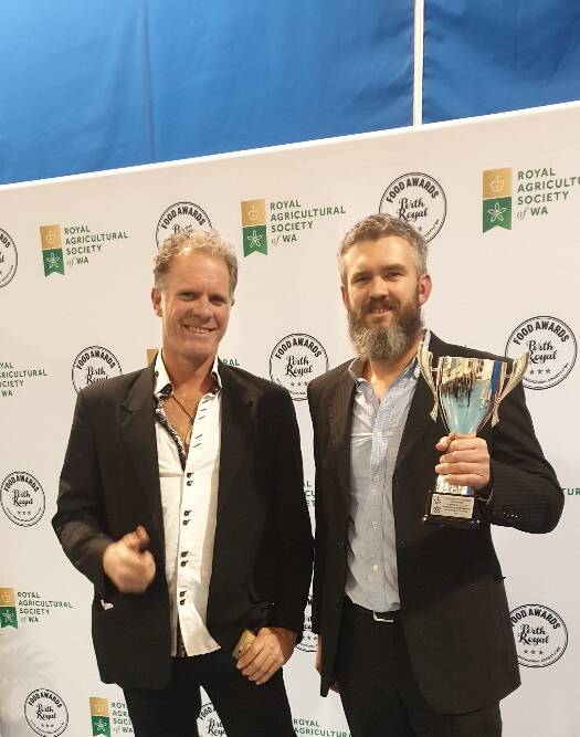 Beery good: The Brewhouse Head co-founder Andrew Dykstra (left) with head brewer Ryan Ashworth and the coveted trophy. Photo: Supplied.