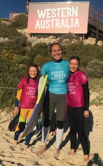 Olive and Willow Hardy with pro surfer Carissa Moore. Photos: Supplied