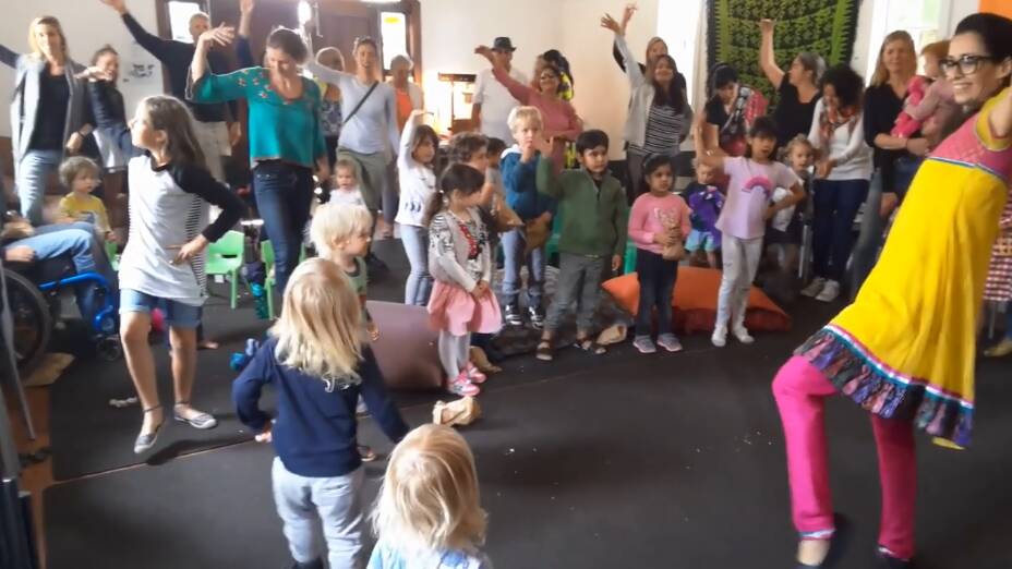 Meire de Mello leads an intercultural dance workshop with kids and adults of all ages. 