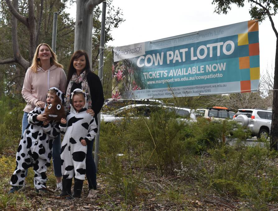 Lucky landing: Andrea and Fraser and Erin and Matilda get into the spirit of the 2018 Montessori School Cow Pat Lotto. Photo: Nicky Lefebvre