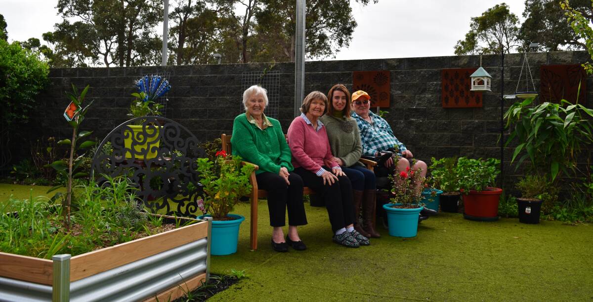 Mirrambeena residents with Dementia Enrichment Officer Julieann Ryan (second from right) in the garden, boosted by a $30,000 Alzheimers WA grant. 