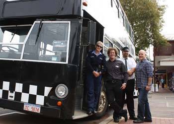 MIDNIGHT BUS: Constable Sally Halliday from Margaret River police, shire acting senior community development officer Gene Hardy, bus driver Daniel Shurmer, and Rob Gough from Settlers Tavern with the Chauffeur Bus that now also helps get people home safely after a night out on Fridays and Saturdays. 