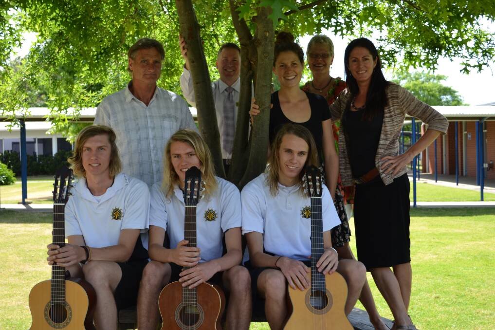 Time to rock: The guitar talents of Margaret River Senior High School's Rohan Backsai, Kieran Renolds and Sean Becker are supported by MRSHS guitar instructor Bruce Godden, principal Andrew Host and head of music Priscilla Denboer, Margaret River Primary School music specialist Helen Collis and parent Lesley Motherwall.