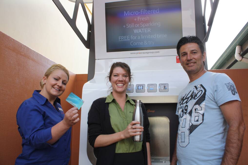 Refreshing change: Margaret River Tourist Information Centre s Bridgette Byrne and Khadine Campany test the new water machine with ProAcqua s Joe Muscara.