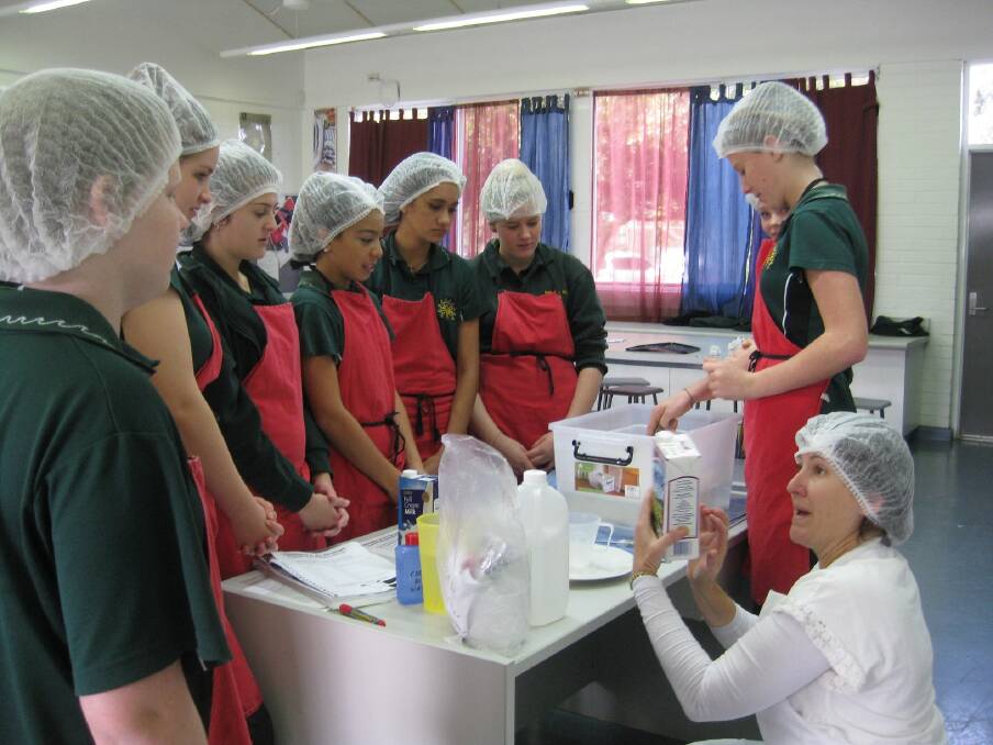 Engaged: Dairy farmer Ros Garstone showing Year 9 students at Margaret River Senior High School how to turn milk into cheese.