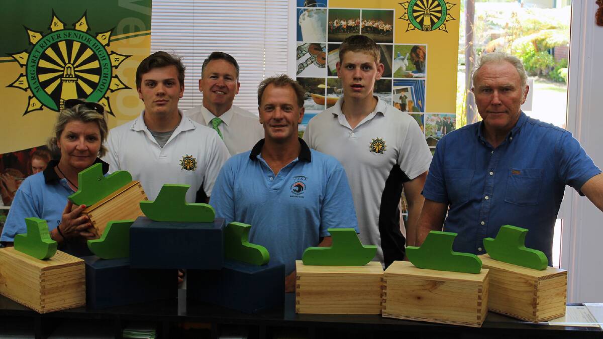 Gifts: Margaret River Sea Search and Rescue s Trish McShane, left, and Jeff Uhd, centre, are happy to receive donation boxes from Margaret River Senior High School s John Busby, year 11, principal Andrew Host, Will Jackson, year 11, and woodwork teacher Ian Thwaites.