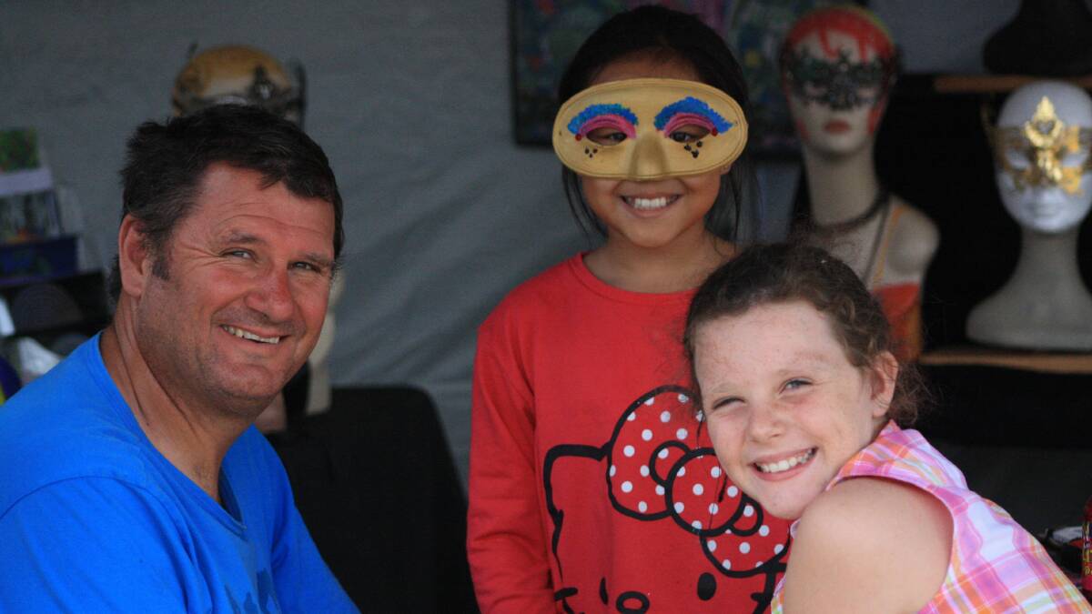Making masks: Rob Damhuis with Fen and Juliana Mortimer of Perth.