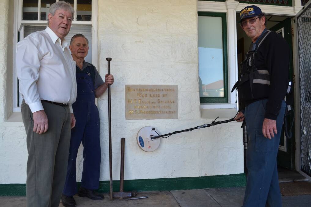TIME PLEASE GENTLEMEN: Jim Challis, John Benbow, 80, who has worked for the hotel since 1952, and Jeff Marshall with a metal detector looking for a hidden time capsule.